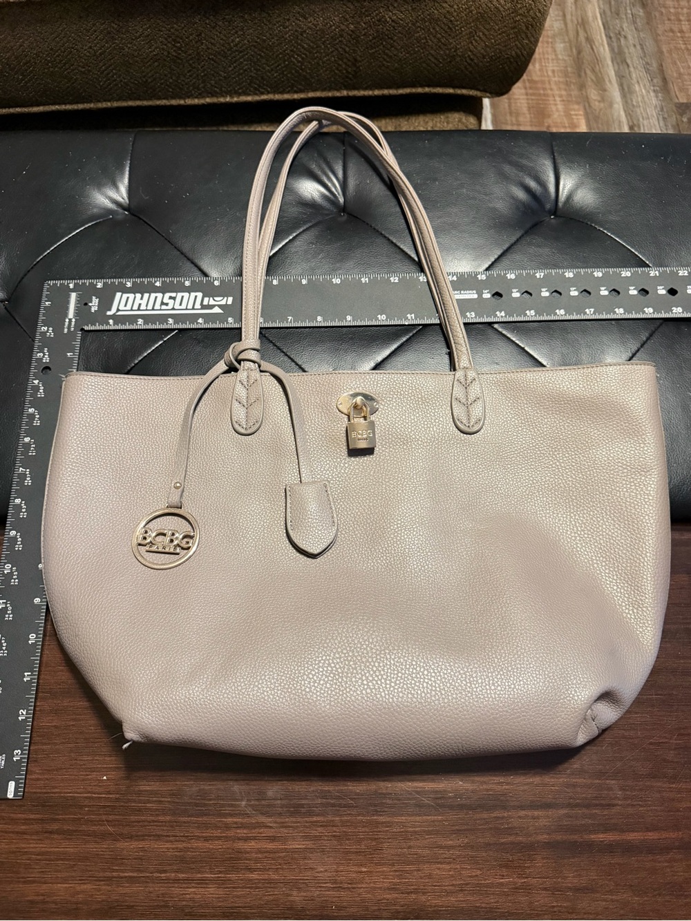 BCBG Taupe Pebbled Leather Tote with Gold-Tone Charm inside phone pocket
